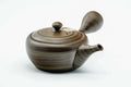 Dark green nerikomi Tokoname kyusu, raised three-quarter view showing the domed lid knob and side handle