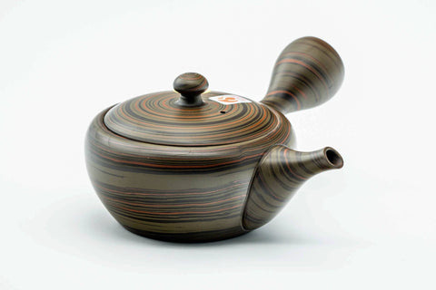 Dark green nerikomi Tokoname kyusu, raised three-quarter view showing the domed lid knob and side handle