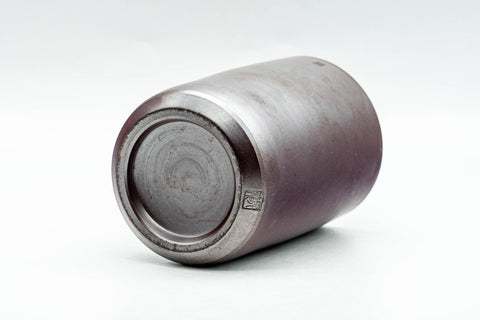 Tilted view showing the lower body and foot of the cup.