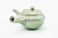 Green celadon Obori Soma kyusu, three-quarter view with the spout to the right and handle to the left