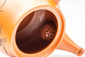 Japanese Kyusu - Bamboo Engraved Red Shudei Tokoname-yaki Ceramic Filter Teapot - 315ml - close-up inside the spout showing the ceramic mesh filter