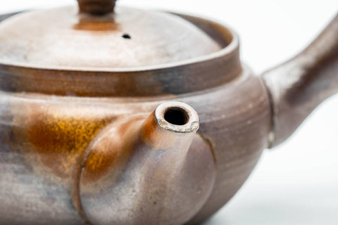 Japanese Kyusu - Ash Glazed Banko-yaki Mesh Teapot - 230ml - lower angled view showing the orange-brown ash scorch marks on the body