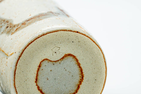 Close-up of the foot and the edge of the Shino glaze.