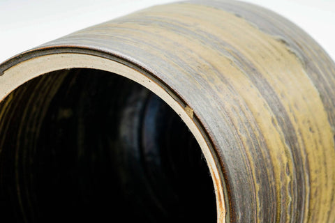 Close overhead look into the open mouth of the mizusashi, showing the pale glazed interior and rim.