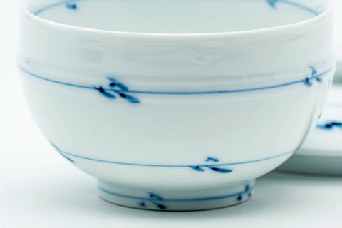 View into the teacup with the lid off, showing the blue motifs inside.