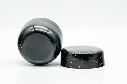 Japanese Natsume - Heavy Speckled Stone Matcha Tea Caddy - 50ml - caddy resting on its side with the lid