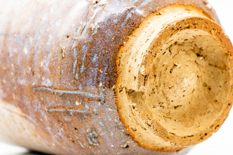 Macro close-up of the toasted foot where glaze meets bare stoneware