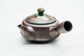 Side view of the kyusu with the spout, lid on.