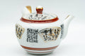 Tezumi — Japanese Tea Set - Geometric Script Kutani-yaki Debeso Kyusu Teapot with Katakuchi Water Cooler and 5 Yunomi Teacups — the teapot and cups arranged together