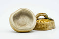 The kogo opened with the lid set beside the base, revealing the pale interior.