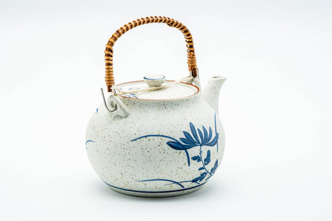 Japanese Dobin - Blue Floral White Textured Arita-yaki Porcelain Teapot - 500ml - three-quarter view with the spout to the left and overhead handle raised