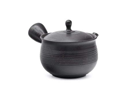 Spiraling benishibori Tokoname teapot, side view of the spiral-ribbed body