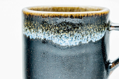 Close-up of the rim detailing the streaked hare's-fur drip glaze.