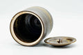 Overhead angle of the open mizusashi with the lid lying to the side, revealing the glazed interior and mouth.