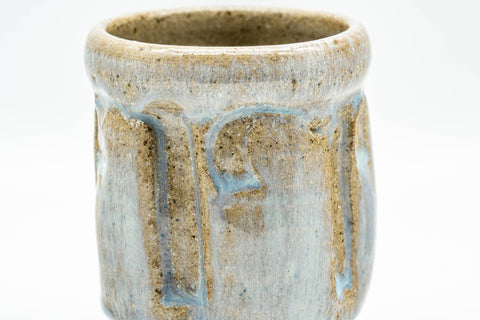 Tezumi — Japanese Teacup - Beige Milky Glazed Groovy Yunomi - 130ml — tipped to show the interior