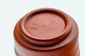 Tezumi — Japanese Teacup - Spiraling Red Shudei Tokoname-yaki Yunomi - 100ml — inverted showing the foot ring
