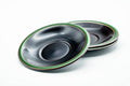 Green-trimmed black saucers fanned and viewed from above at an angle, showing the contrasting green edge.
