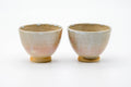 The paired cups from another angle, showing the soft Hagi glaze.
