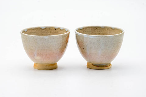 The paired cups from another angle, showing the soft Hagi glaze.