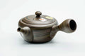 Dark green nerikomi Tokoname kyusu, front view with the spout pointing left and the lid seated