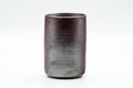 Back/side view of the cup showing the plain lustrous gunmetal glaze.