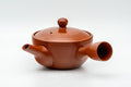 Japanese Kyusu - Spiraling Red Shudei Tokoname-yaki Mesh Teapot - 250ml - side profile with the spout to the left