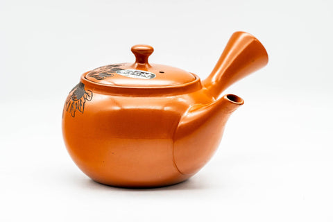 Front view of the glossy red shudei teapot showing the spout and side handle.