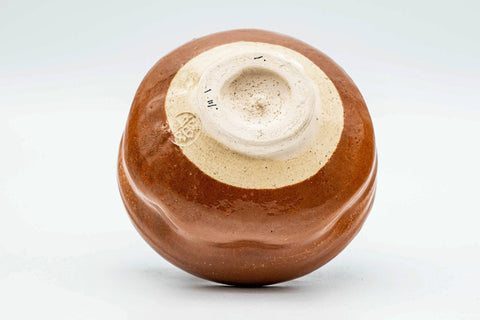 Inverted view of the aka-raku chawan showing the foot and underside
