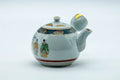 Tezumi — Japanese Tea Set - Villager Decorated Kutani-yaki Kyusu Teapot with 3 Lidded Yunomi Teacups — the teapot in three-quarter view