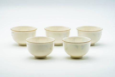 Japanese Teacups - Set of 5 Kozan Kiln Purple Floral Mino-yaki Porcelain Yunomi - the five cups clustered front-on showing their white glazed bodies