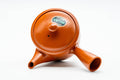 Top-down view of the teapot showing the lid and side handle.