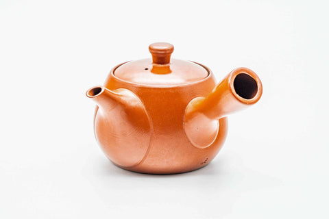 Red shudei Tokoname kyusu, three-quarter view from the rear with the handle to the right