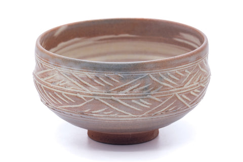 Pink-white hakeme chawan, front view showing the combed band and hakeme brushwork together