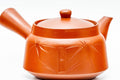 Teapot seen from the back, lid on, showing the smooth red clay body