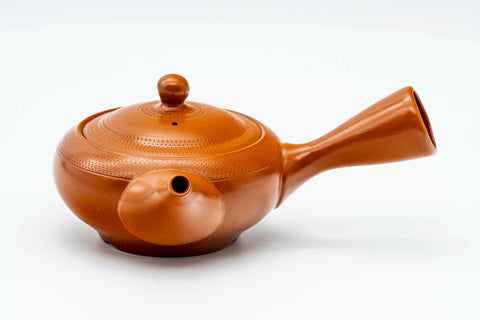 Red shudei Tokoname kyusu, three-quarter view from the rear with the handle to the right