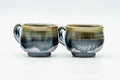 Pair of handled cups with a blue-green drip glaze, shown side by side.