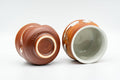 Tezumi — Japanese Teacups - Pair of Orange White Textured Glazed Yunomi - 100ml — three-quarter view