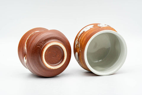 Tezumi — Japanese Teacups - Pair of Orange White Textured Glazed Yunomi - 100ml — three-quarter view