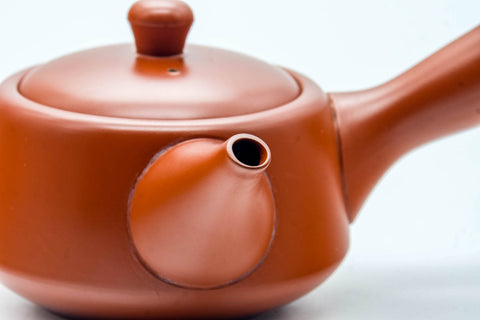 Japanese Kyusu - Smooth Red Shudei Tokoname-yaki Ceramic Filter Teapot - 300ml - three-quarter view showing the spout and handle junction