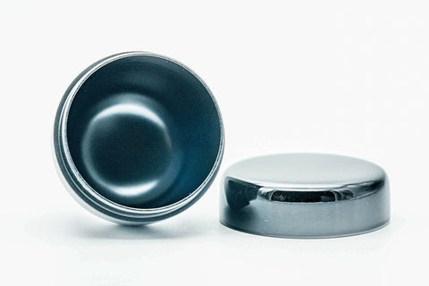 Open natsume caddy with the lid lying flat beside it, revealing the glossy interior.