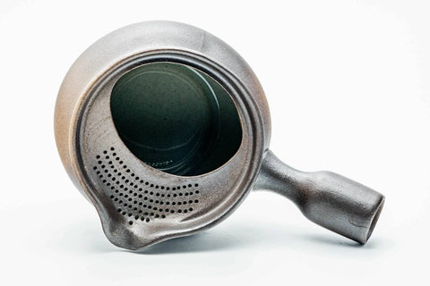 Overhead view of the dark yohen kyusu showing the wide open mouth and green-glazed interior