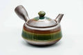 Three-quarter view of the green-glazed banko kyusu with the lid on.