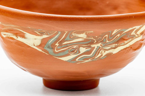 Closeup of the gold-flecked nerikomi marbled decoration on the body of the chawan