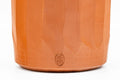 Japanese Teacups - Pair of Carved Red Shudei Tokoname-yaki Meoto Yunomi - close-up of a single cup showing the faceted carving and maker's stamp