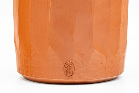 Japanese Teacups - Pair of Carved Red Shudei Tokoname-yaki Meoto Yunomi - close-up of a single cup showing the faceted carving and maker's stamp