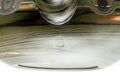 Close-up of the lower body and base showing the swirled marbled clay.