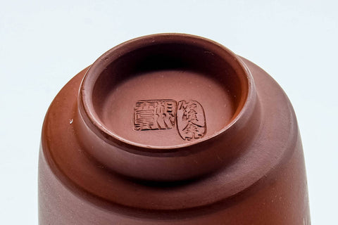 Tezumi — Japanese Teacup - Engraved Calligraphy Red Shudei Tokoname-yaki Yunomi - 120ml — closeup of the glaze
