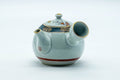 Tezumi — Japanese Tea Set - Villager Decorated Kutani-yaki Kyusu Teapot with 3 Lidded Yunomi Teacups — interior of the teapot showing the filter