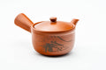 Japanese Kyusu - Mountainous Red Shudei Tokoname-yaki Mesh Teapot - 270ml - three-quarter view of the red shudei body with an engraved mountainous landscape, lid on and side handle to the right