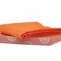 7号 Vermillion Orange Silk Shioze Fukusa - folded vermillion orange silk fukusa resting on its patterned box